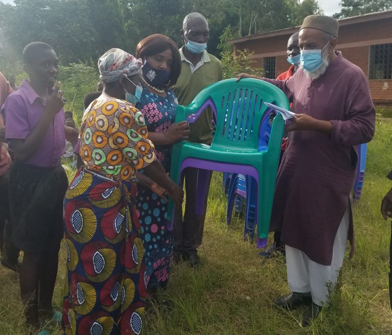 OG Issah Donates Plastic Chairs to Zomba School